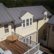 Aerial view of roof, siding and deck