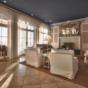 Family room with tall windows and knock out view